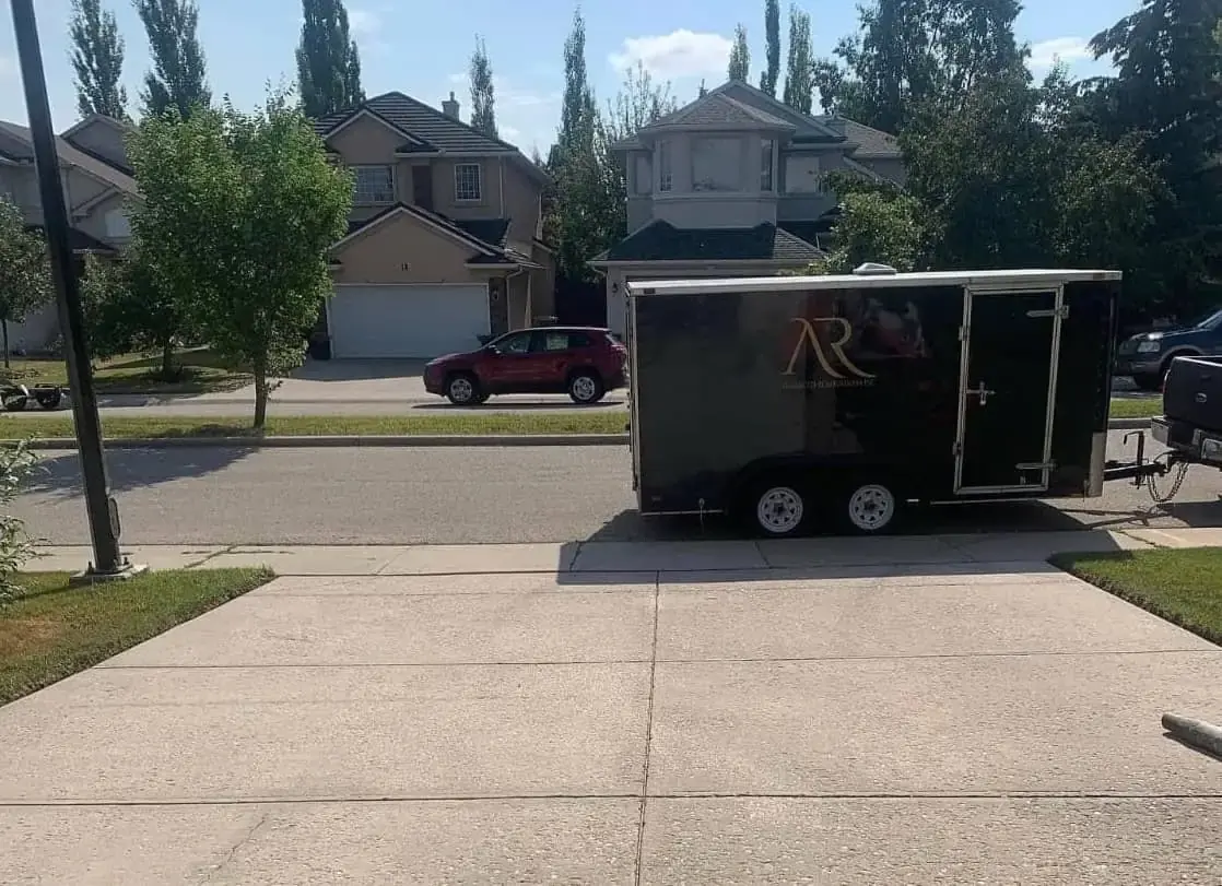 Advanced Renovations Inc. trailer at a residential job site in Calgary