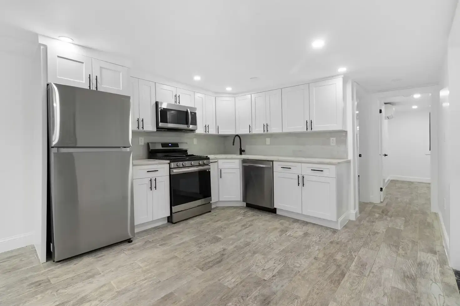 Finished basement renovation with modern lighting and functional living space in Calgary